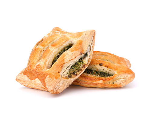 Puff pastry bun isolated on white. Healthy patty with spinach.