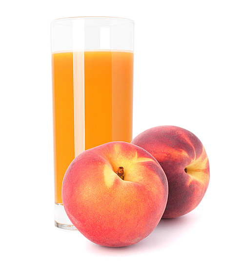 Peach fruit juice in glass isolated on white cutout