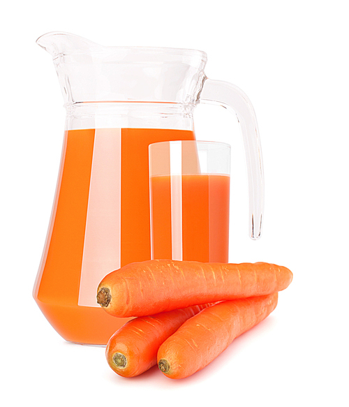 Carrot vegetable juice in glass jug isolated on white cutout