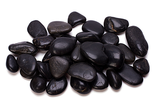 Heap of black pebbles isolated on white
