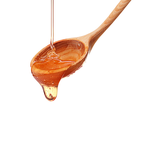 Honey dripping from a wooden honey dipper isolated on white cutout