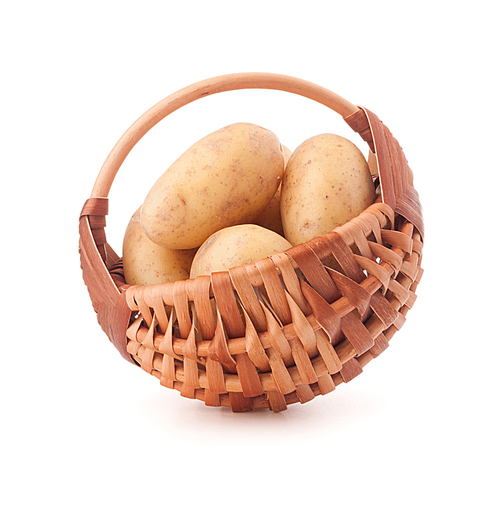 Potato tuber  in wicker basket isolated on white