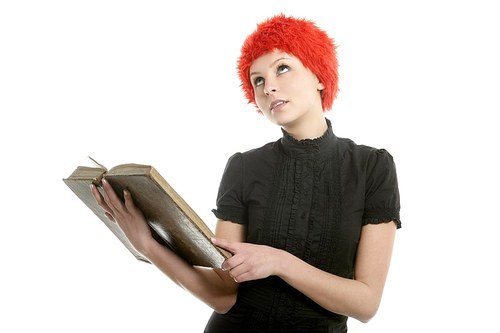 유토이미지 | Beautiful woman|orange wig reading old book|isolated on white