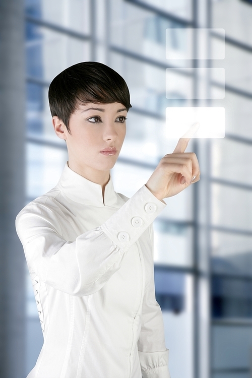 유토이미지 | futuristic businesswoman finger touch pad on modern office