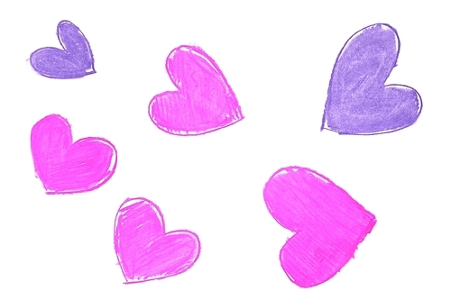 Colorful hand painted heart shapes draw on an white background