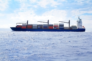 sea cargo merchant ship sailing in blue ocean full of containers