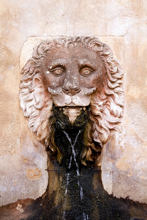 Lion stone sculpture fountain in Son Marroig at Deia Mallorca