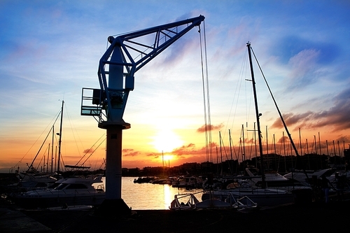 dock crane port sunset in Salou Tarragona Spain