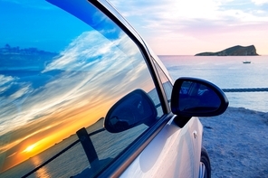 Ibiza cala Conta Conmte susnset reflection y car window glass