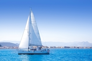 sailboat sailing in Mediterranean sea in Denia blue Mediterranean