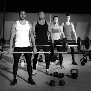 gym group with weight lifting bar workout in crossfit exercise