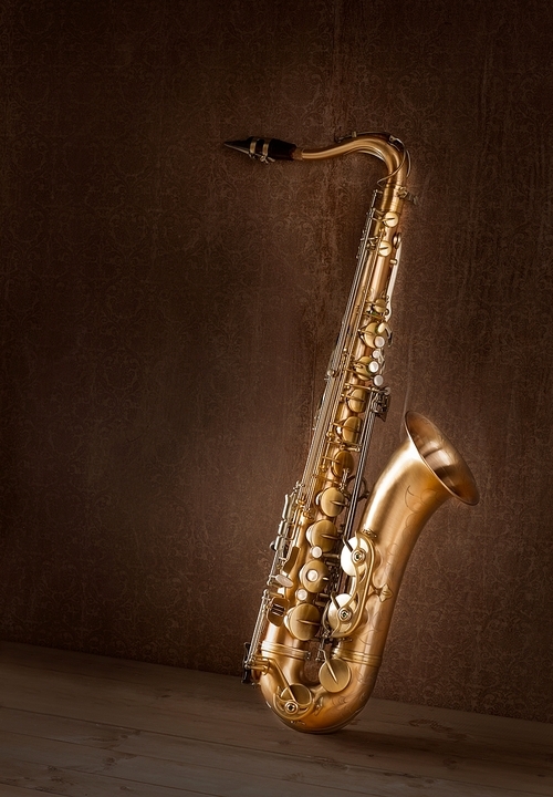 Sax golden tenor saxophone in vintage retro background