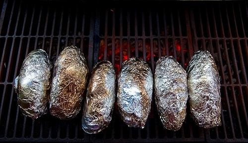 grilled whole potatoes with foil delicious meal and embers