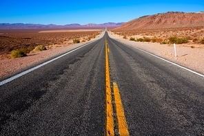 Never ending road to Death Valley California sunny desert