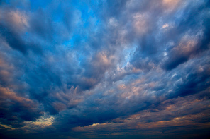 Dramatic sky with stormy clouds in sunset sunrise