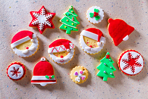 Christmas cookies Xmas tree Santa snowflake on recycled paper background