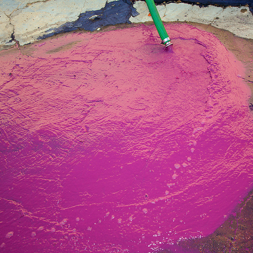 Wine vinasse rich in tartaric acid in magenta pink color cleaning the dregs of barrels