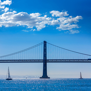 San Francisco Bay bridge sailboat from Pier 7 in California USA