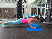 brunette woman at gym push up push-up workout exercise