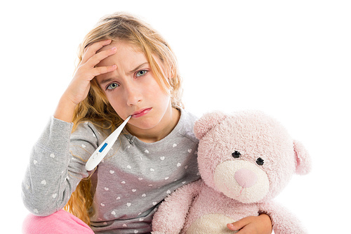 blond girl with thermometer and flu cold in pyjama  grumpy face with teddy bear