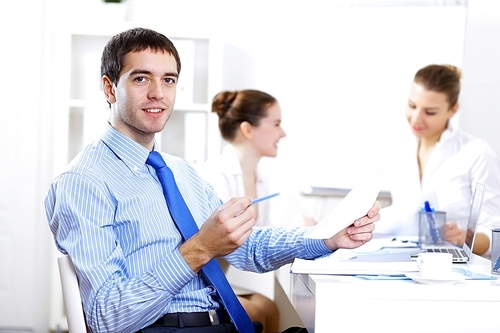 Young and successful businessman in the office