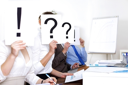 Image of businessmen in office with question marks