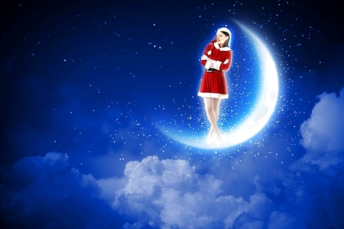 photo of santa girl sitting on the moon