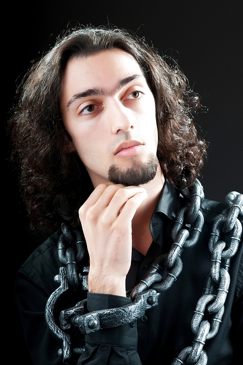 Man with metal chain around him