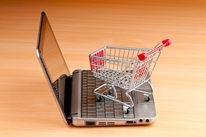 Internet online shopping concept with computer and cart