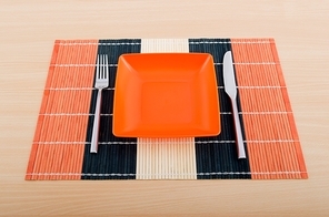 Emtpy plates with utensils on table