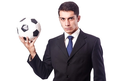 Young businessman with football on white