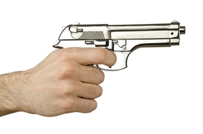 Gun in the hand on white