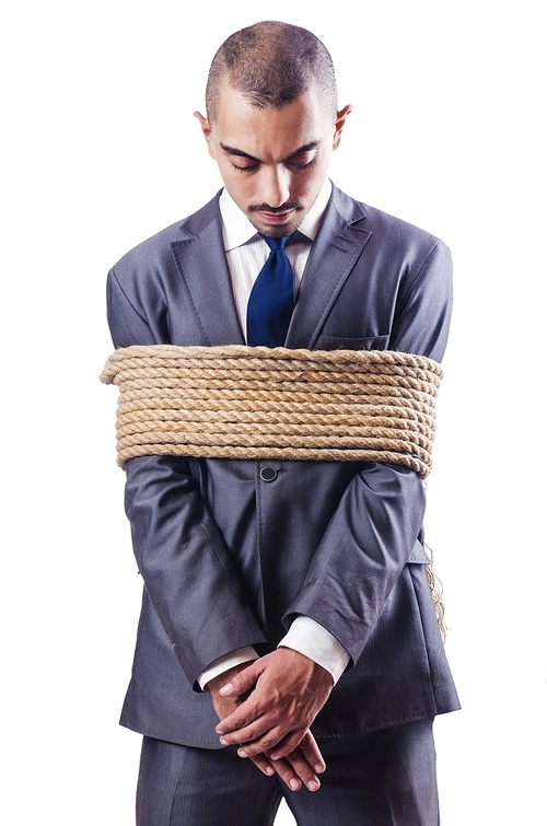 Businessman tied up with rope