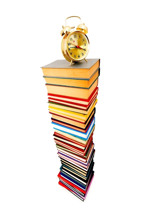 Back to school concept with books and clock