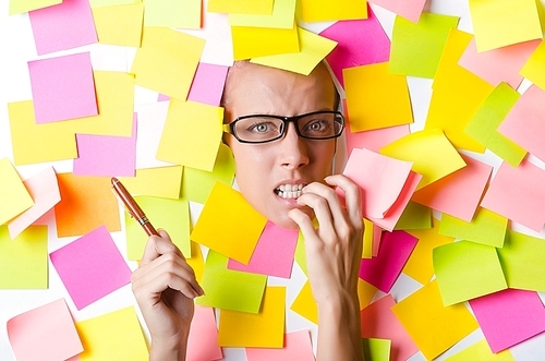 Woman with lots of reminder notes