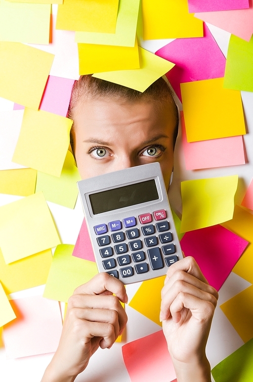 Businesswoman with lots of reminder notes