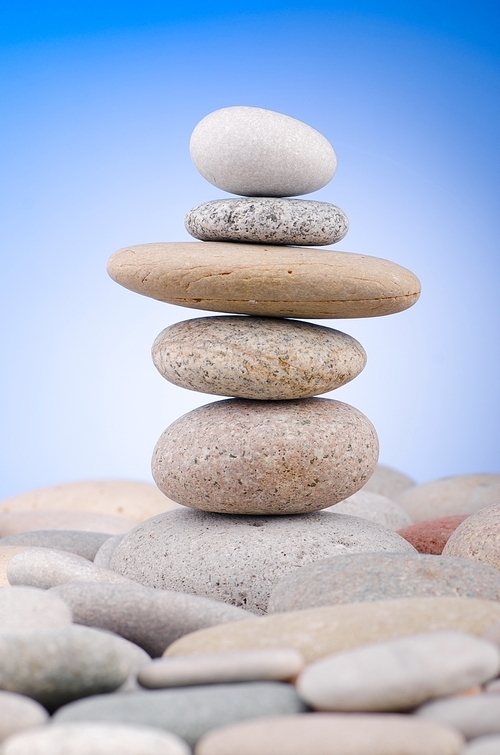 Pebbles stack against gradient background