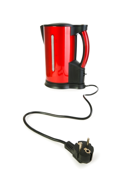 Red electrical kettle isolated on white