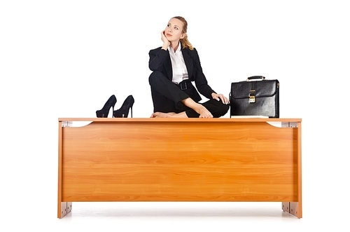 Businesswoman meditating isolated on white