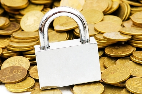 Concept of financial security with lock and coins