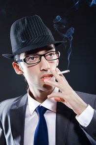 Young man smoking cigarette