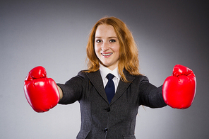 Woman boxer in dark room