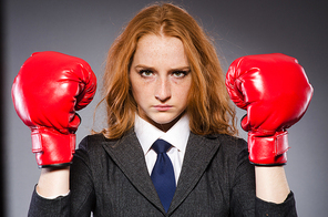 Woman boxer in dark room