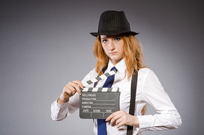 Young woman with movie board