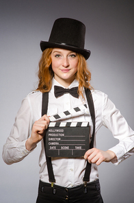 Young woman with movie board