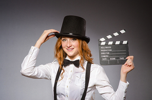 Young woman with movie board