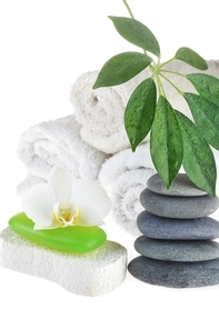 towel|green soap and stones on white
