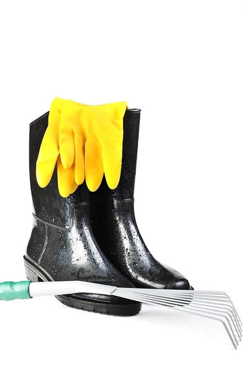Gardening tools: rubber boots|rake and yellow  gloves