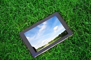 generic tablet computer (tablet pc)  on green grass
