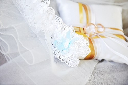 Garter and wedding rings close up